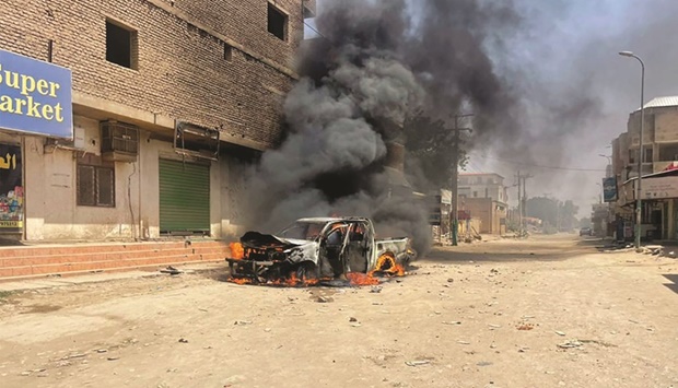 This picture taken yesterday shows a view of a burning vehicle in the wake of clashes in Sudanu2019s eastern city of Kassala.