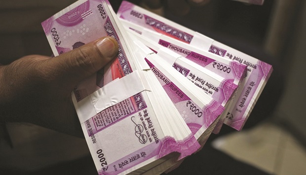 The Indian rupee fell to more than 80 per US dollar for the first time on record yesterday, as the greenback extended its rally and foreign capital outflows intensified