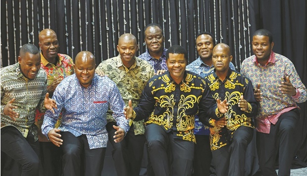 Members of the Ladysmith Black Mambazo gesture during the rehearsals during a powercut ahead of singing their warm-hearted choral harmonies in honour of peace icon Nelson Mandela at the Joburg Theatre in Johannesburg last Friday. (Reuters)