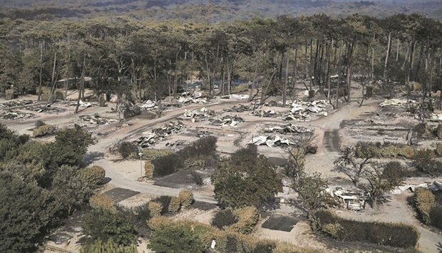 A general view of camping u201cLes Flots Bleusu201d which has been ravaged by a wildfire in Pyla sur Mer in Gironde, southwestern France. An area 9km long and 8km wide was still ablaze near Franceu2019s u201cDune de Pilatu201d, Europeu2019s highest sand dune, turning picturesque landscapes, popular campsites and pristine beaches into a scorching mess.