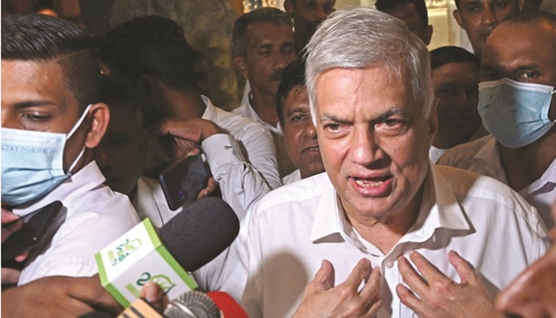 Sri Lankau2019s newly elected president Ranil Wickremesinghe addresses the media representatives during his visit at the Gangaramaya Buddhist temple in Colombo, yesterday.