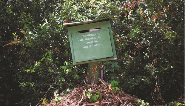 A box containing a sensor to monitor groundwater is placed near a lake as ageing infrastructure and leaky pipes mean a lot of Italyu2019s precious water is going down the drain before it can even reach the taps, in Cisterna di Latina, Italy. (Reuters)