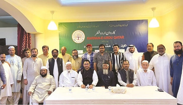 Guests with poets who graced the mushaira.