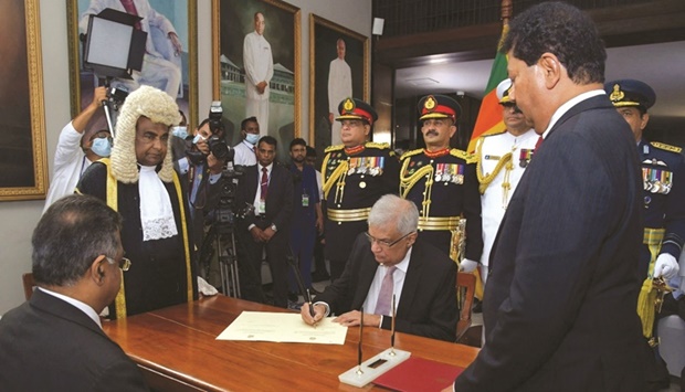Wickremesinghe is sworn in as president by Chief Justice Jayantha Jayasuriya.