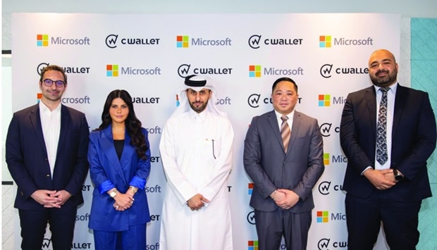 From left: Microsoft officials Jamal Bdeir and Lana Khalaf together with CWallet officials Dr Abdulmohsin al-Yafei, Michael Javier, and Mohamed el-Sayegh during the signing ceremony.