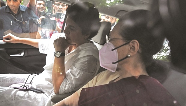 Sonia Gandhi leaves her residence with her daughter Priyanka and her son Rahul (not pictured) for questioning in an alleged money laundering case at the Enforcement Directorate (ED) office in New Delhi.