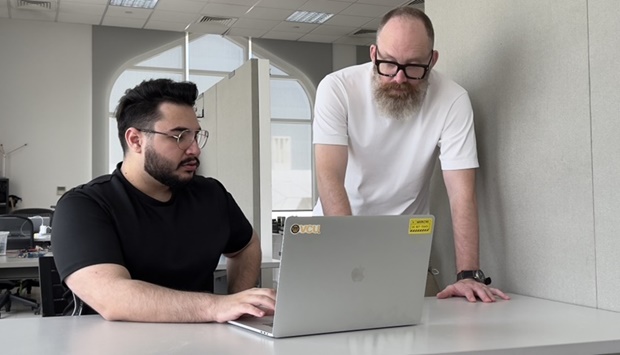 Abdulrahman Alkhatib (left) with Levi Hammett.