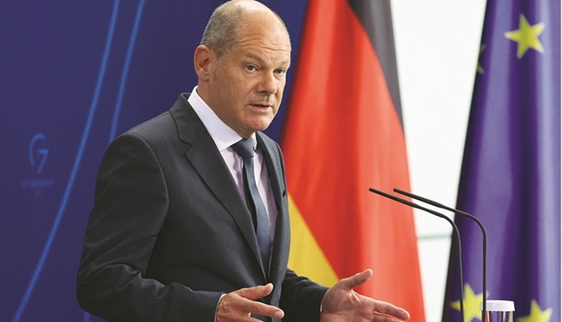 German Chancellor Olaf Scholz holds a news conference on energy situation, at the Chancellery in Berlin, yesterday. Scholz promised to shield Germans from surging energy costs.