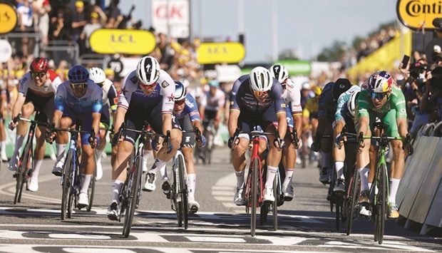 Quick-Step Alpha Vinyl Teamu2019s Fabio Jakobsen crosses the line to win second stage of the 109th edition of the Tour de France cycling race, 202.2km between Roskilde and Nyborg, in Denmark, yesterday. (Reuters/AFP)