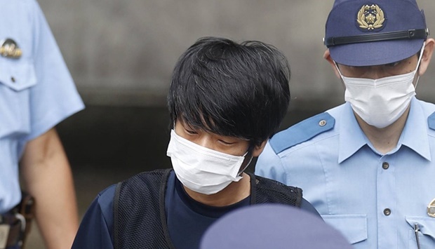Tetsuya Yamagami leaves a police station in the city of Nara. Source: KYODO