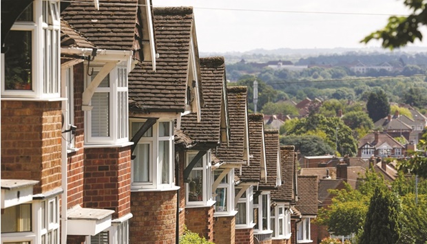 A terrace of homes on a hill in Birstall, UK. Lenders are pulling mortgage products to avoid being overwhelmed by surging demand from customers seeking to fix their payments amid record rises in home loan rates.