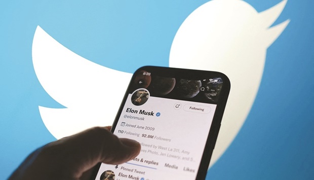 Elon Musku2019s Twitter account with a Twitter logo in the background in Los Angeles. Twitter scored an early win against Musk in its fight to make him complete his $44bn buyout, as a Delaware judge agreed to fast-track the case with an October trial date.