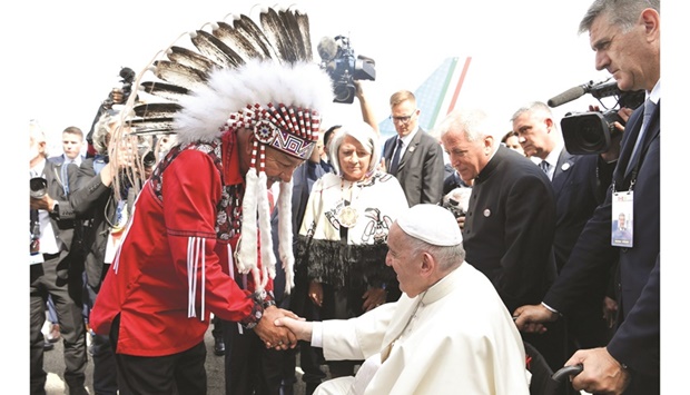 Pope Francis is welcomed after arriving at Edmonton International Airport, near Edmonton, Alberta, Canada, yesterday. (Reuters)