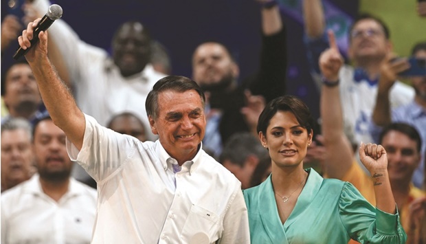 Brazilian President Jair Bolsonaro (left) and his wife Michelle Bolsonaro attend the Liberal Party national convention where he was officially appointed as candidate for re-election, at the Maracanazinho gymnasium in Rio de Janeiro yesterday. (AFP)