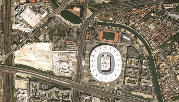 This handout satellite image picture released yesterday by Airbus Defense and Space shows the Stade de France Stadium in Saint-Denis, near Paris, and the nearby under-construction aquatic centre which will both host competitions during the Paris 2024 Olympic Games. (AFP)