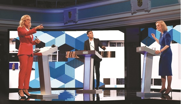 Truss (right) and Sunak take part on Monday evening in the BBCu2019s The UKu2019s Next Prime Minister: The Debate, with host Sophie Raworth in Victoria Hall in Stoke-on-Trent, central England.