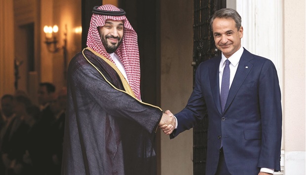 Greek Prime Minister Kyriakos Mitsotakis greets Saudi Crown Prince Mohamed bin Salman prior to their meeting at the prime ministeru2019s office in Athens, yesterday.