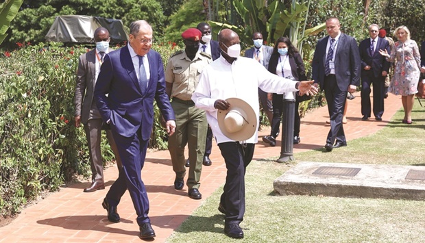 Russian Foreign Minister Sergei Lavrov and Ugandan President Yoweri Museveni arrive for a joint press conference in Entebbe, yesterday.