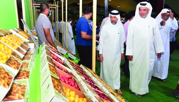 Private Engineering Office's Abdulrahman Mohamed al-Nemah and Ministry of Municipality's Yousef Khalid al-Khelaifi tour the festival after opening it Wednesday at Souq Waqif in Doha. PICTURE: Shaji Kayamkulam.