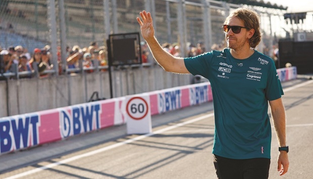 Aston Martinu2019s Sebastian Vettel acknowledges the fans ahead of the Hungarian Formula One Grand Prix at the Hungaroring, Budapest, Hungary, yesterday. (Reuters)