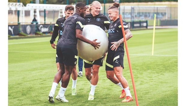 Manchester Cityu2019s Erling Haaland (centre) shares a laugh with teammates during a training session yesterday, ahead of the  Community Shield match against Liverpool.