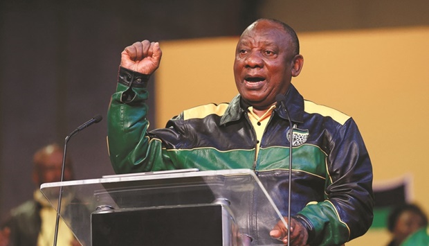 South Africau2019s President Cyril Ramaphosa gestures as he addresses African National Congress (ANC) delegates at the National Recreation Center (Nasrec) in Johannesburg, yesterday.