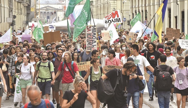 Activists stage a protest against climate change in Turin.