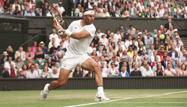 Spainu2019s Rafael Nadal in action during his third round match against Italyu2019s Lorenzo Sonego on the sixth day of the 2022 Wimbledon Championships in southwest London yesterday. (Reuters)