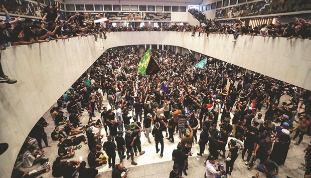 Supporters of cleric Moqtada al-Sadr cheer after entering Iraqu2019s parliament in Baghdad.