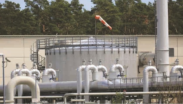 A windsock indicates wind direction above a storage tank at the gas receiving compressor station of the Nord Stream 1 natural gas pipeline in Lubmin, Germany.