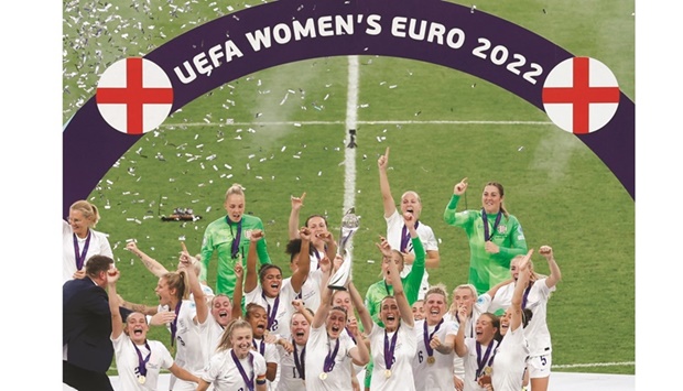 Englandu2019s Ellen White lifts the trophy as she celebrates with teammates after  winning Womenu2019s Euro 2022 yesterday. (Reuters)