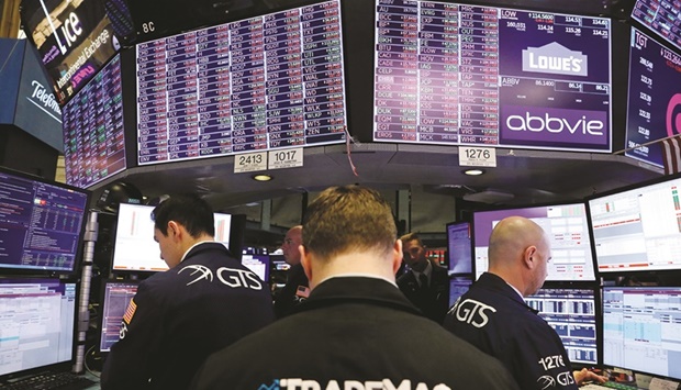Traders work on the floor of the New York Stock Exchange (file). The US stock market is reeling from its worst first half of any year since 1970, with investors girding for a series of potential flashpoints in July that may set Wall Streetu2019s course for the coming months.