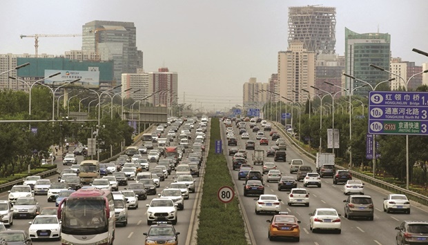 Cars drive on the road during the morning rush hour in Beijing (file). Thereu2019s a chance fuel prices stay at todayu2019s levels if demand in China continues recovering as the government eases coronavirus restrictions, says Mike Muller, head of Asia at Vitol Group.