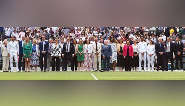 Former winners of Wimbledon pose during the Centre Court Centenary Ceremony, on the seventh day of the 2022 Wimbledon Championships at The All England Tennis Club in Wimbledon, southwest London, yesterday. (AFP)