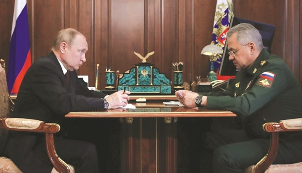 Russian President Vladimir Putin issuing instructions to Defence Minister Sergei Shoigu in Moscow yesterday. (Reuters)