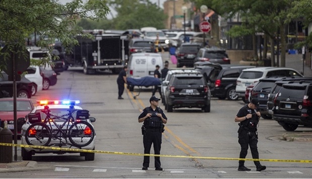 First responders take away victims from the scene of a mass shooting at a Fourth of July parade on July 4, 2022 in Highland Park, Illinois.