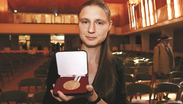 Maryna Viazovska poses with her medal during the prize ceremony at the International Congress of Mathematicians 2022 in Helsinki yesterday. (Reuters)