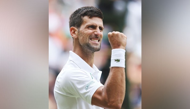 Serbiau2019s Novak Djokovic celebrates defeating Italyu2019s Jannik Sinner in their Wimbledon quarter-final in London yesterday. (AFP)
