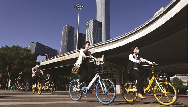 People riding bicycles in Beijingu2019s central business district. Chinau2019s Ministry of Finance is considering allowing local governments to sell 1.5tn yuan ($220bn) of special bonds in the second half of this year, an unprecedented acceleration of infrastructure funding aimed at shoring up the countryu2019s beleaguered economy.