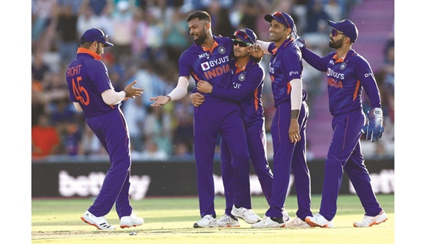 Indiau2019s Hardik Pandya (second from left) celebrates with teammates after taking the wicket of Englan