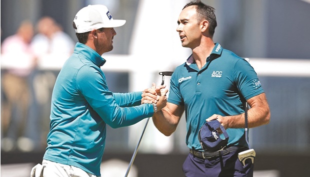 Chileu2019s Mito Pereira and Cameron Tringale of the US shake hands after the first round of the Scottish Open at The Renaissance Club, North Berwick, Scotland, Britain, yesterday. (Reuters)