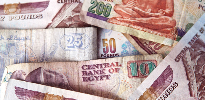 Egyptian pound bank notes are arranged for a photograph in Cairo, Egypt. Forward contracts indicated a significant fall yesterday for the countryu2019s cu