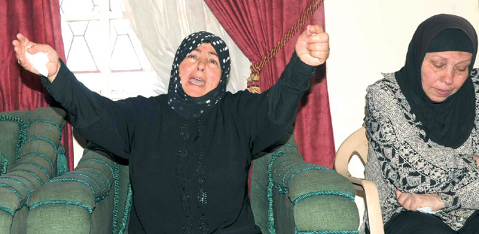 Nadimeh, mother of Ali Mounzer, one of the three Lebanese soldiers who were killed at an army checkpoint, mourns his death in Riyaq village in the Bek