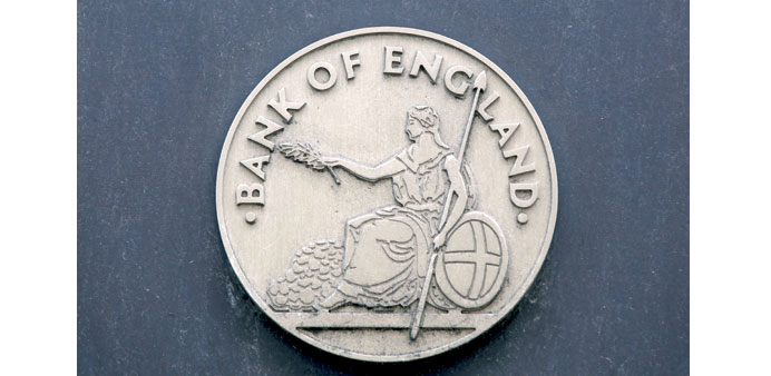 A sign for the Bank of England sits at the entrance to the banku2019s museum in London. Bank of England held fire on quantitative easing on Thursday.