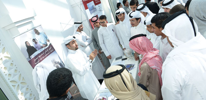 Students interacting with a QDVC representative.