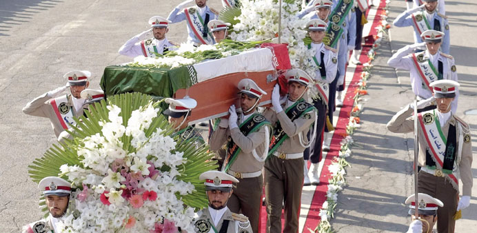 The coffins of Iranians killed in a stampede at the Haj are carried by soldiers at Mehrabad airport in Tehran yesterday.