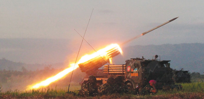Indonesian troops fire multiple rockets during a major military jungle warfare exercise in Poso, in central Sulawesi island.