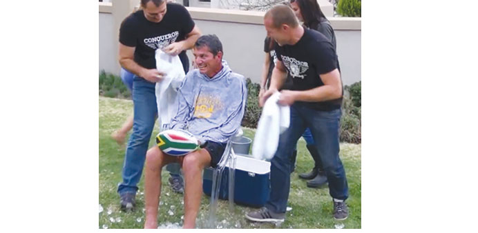 Family and friends help Joost van der Westhuizen, who was part of the 1995 World Cup winning South African team, with his ice-bucket challenge. Van de