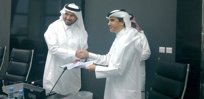 Ibrahim Almuftah and Alkhorayef Group commercial manager Mohamed Alkhorayef shaking hands after signing the deal.