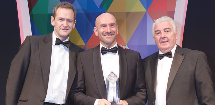 A Qatar Airways executive with the u201cBest long-haul airlineu201d award at the 18th annual Business Travel Awards ceremony.